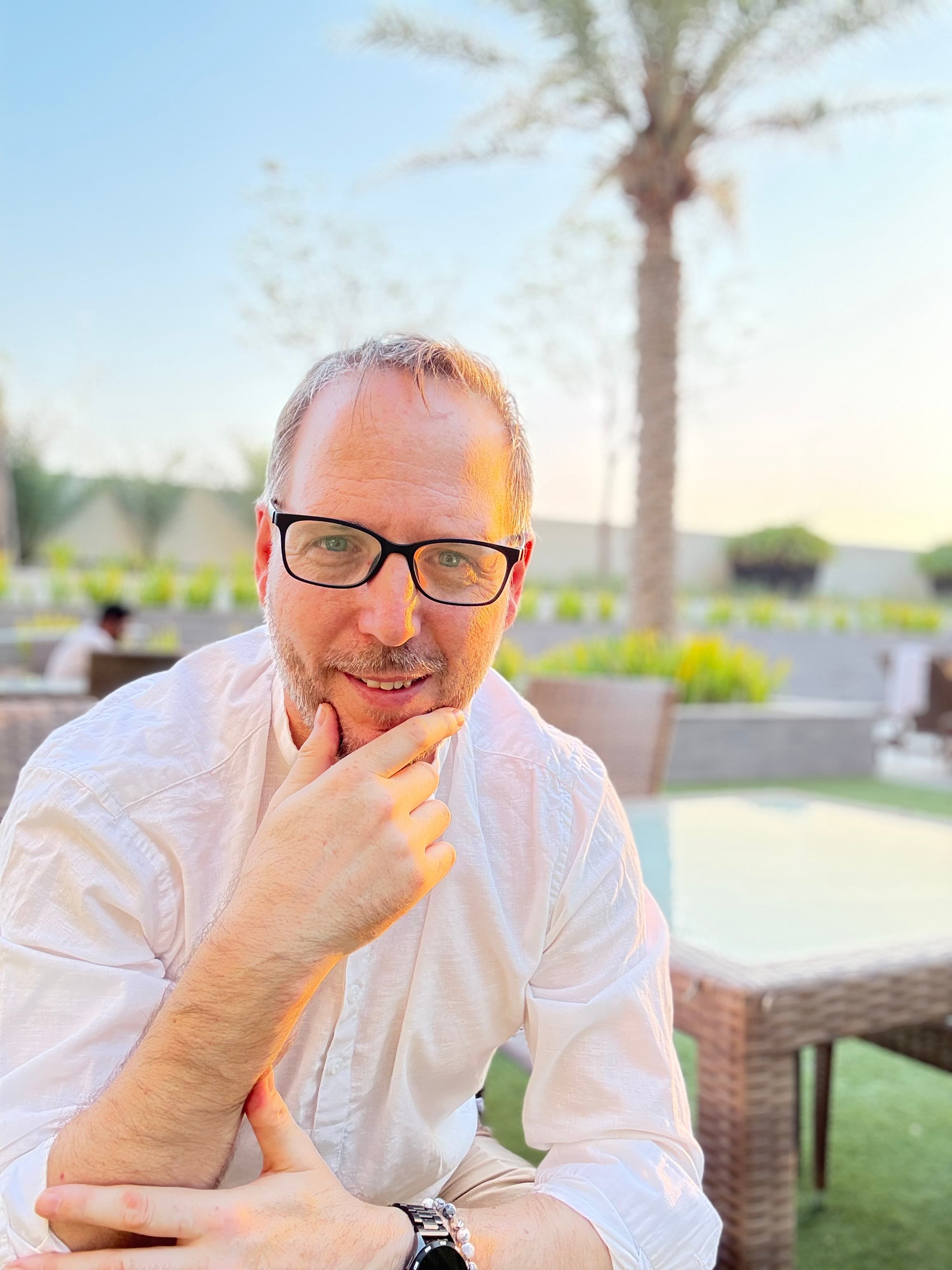 Dr Attila Jonas seated outdoors